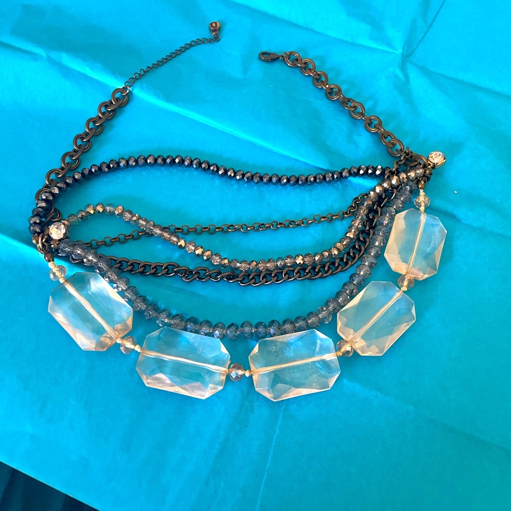 Lovely necklace with glass beads and copper colored chains.